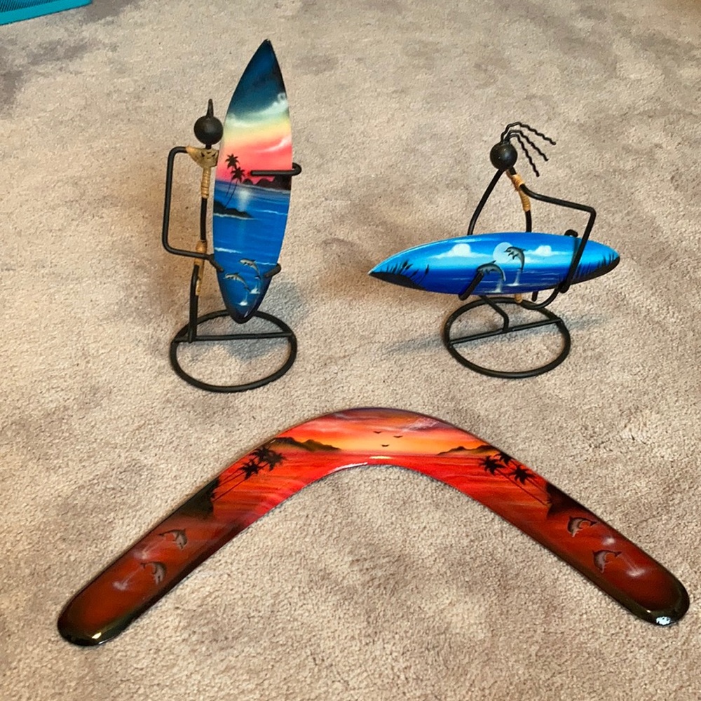 Surfer guys and boomerang with dolphins